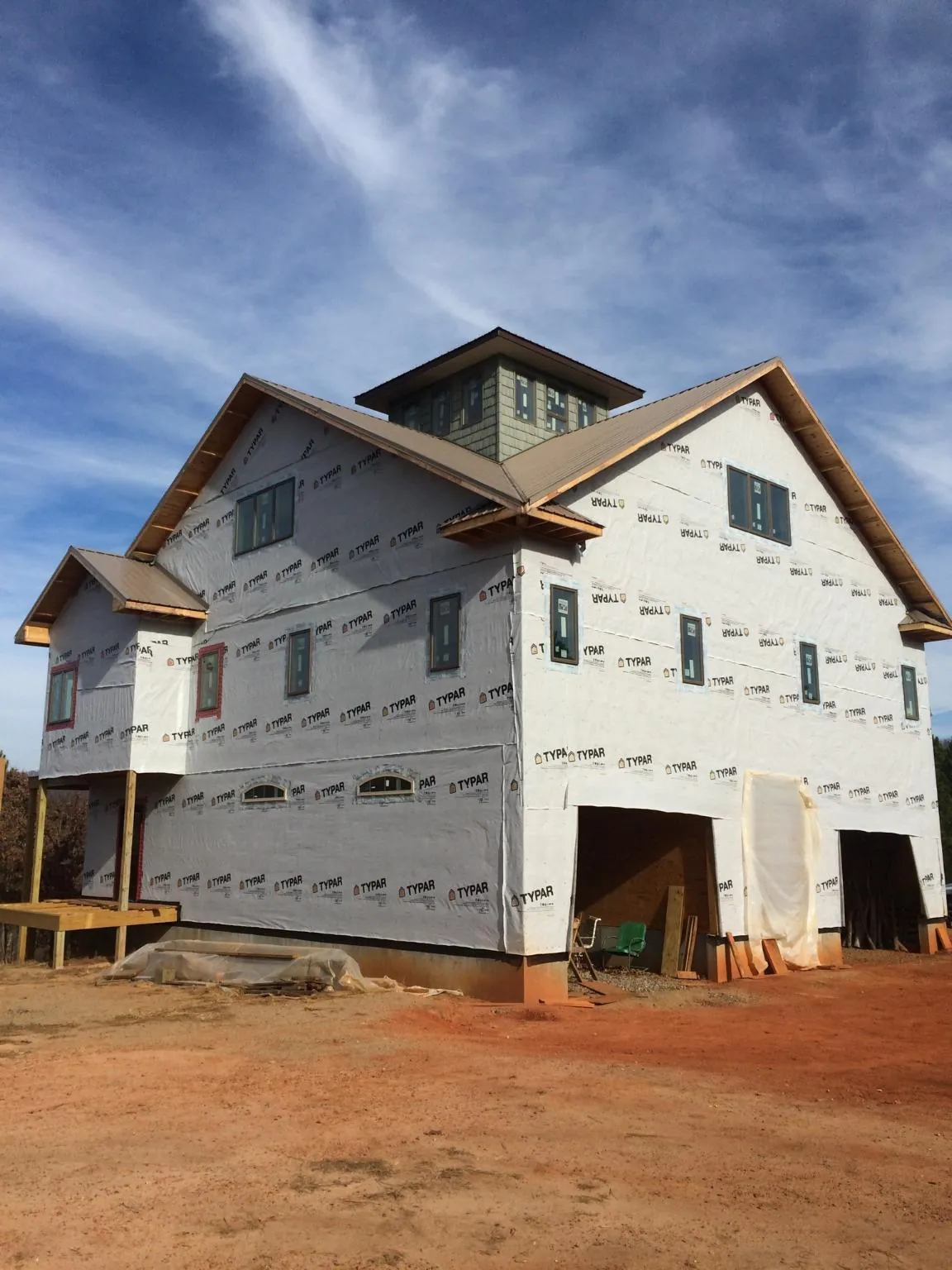 New two story house under construction with a cupola and gabled roofs in Bergholz